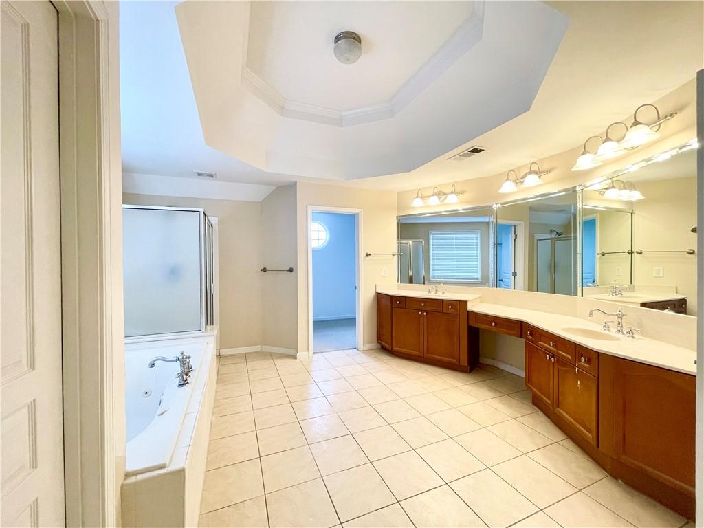 555 Vinings Springs Drive Southeast Mableton, GA 30126 - Photo 30 of 57 a large bathroom with a large tub and sink