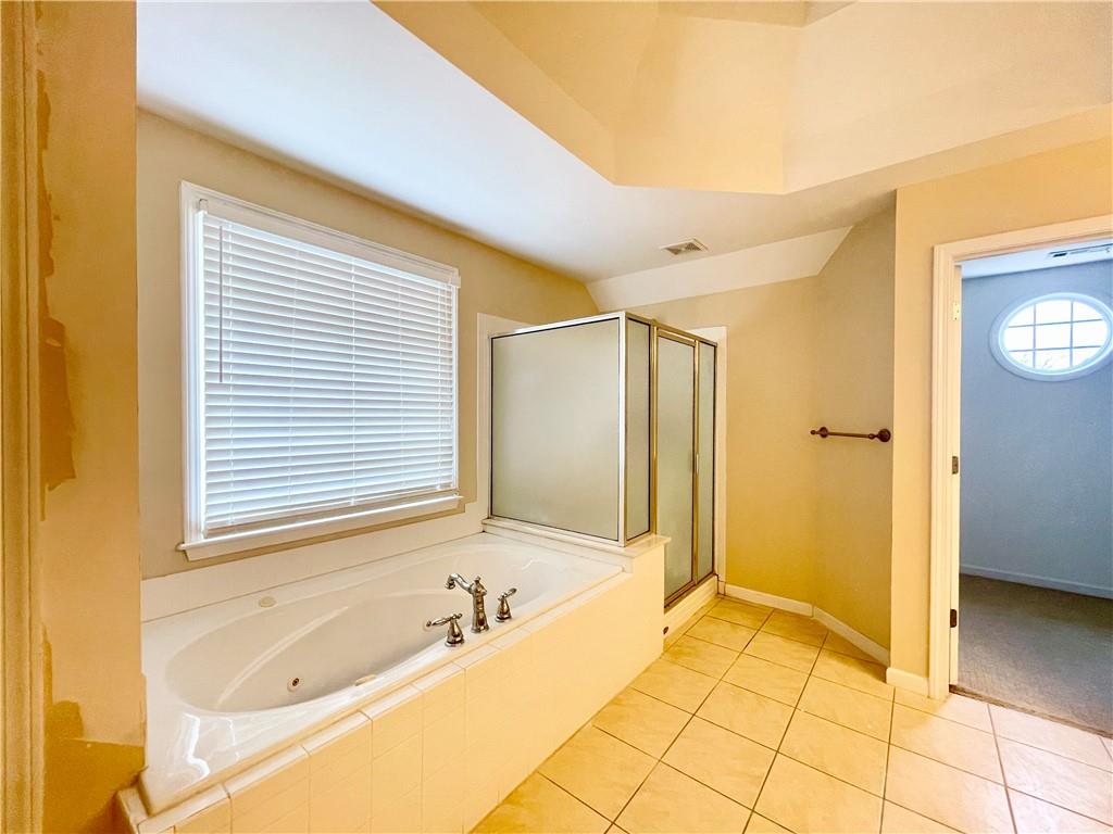 555 Vinings Springs Drive Southeast Mableton, GA 30126 - Photo 32 of 57 a spacious bathroom with a tub shower and a sink