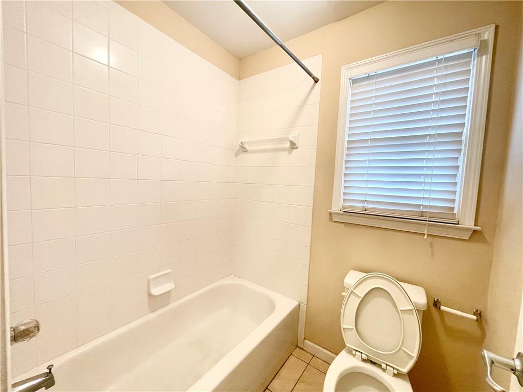 555 Vinings Springs Drive Southeast Mableton, GA 30126 - Photo 46 of 57 a bathroom with a granite countertop toilet sink and mirror