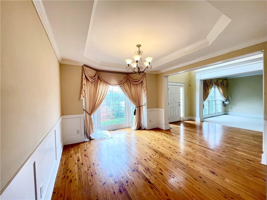 555 Vinings Springs Drive Southeast Mableton, GA 30126 - Photo 7 of 57 a view of empty room with wooden floor and fan