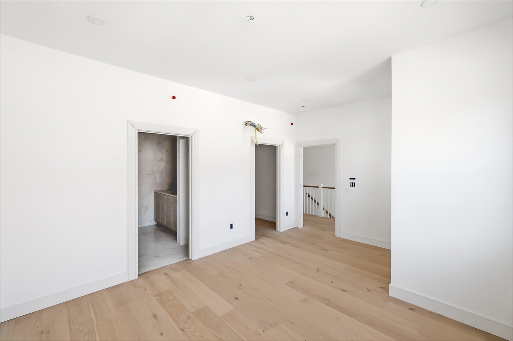 13 Elizabeth Lane, Unit 13 Easthampton, MA 01027 - Photo 11 of 26 a view of a room with wooden floor and bathroom