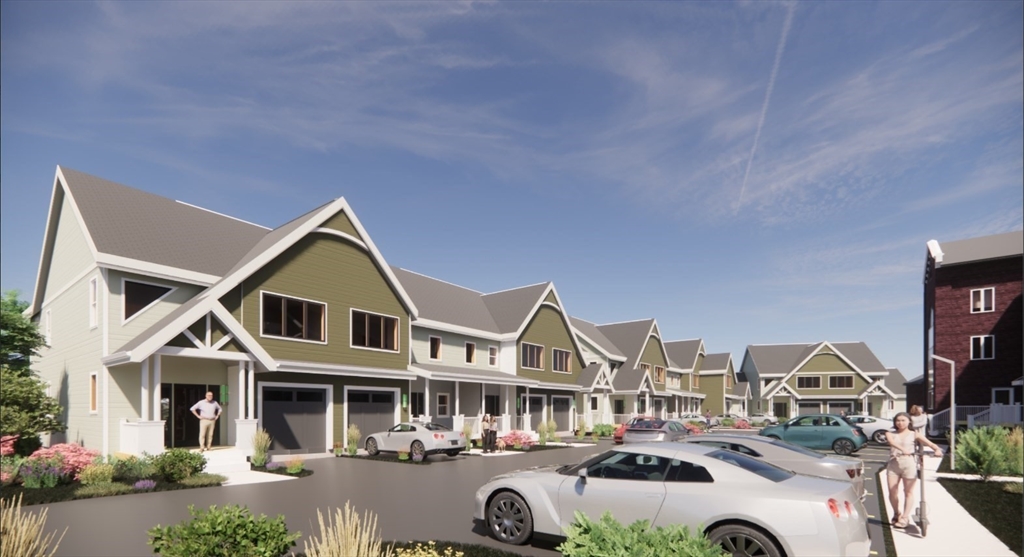 13 Elizabeth Lane, Unit 13 Easthampton, MA 01027 - Photo 15 of 18 a front view of a residential apartment building with a yard