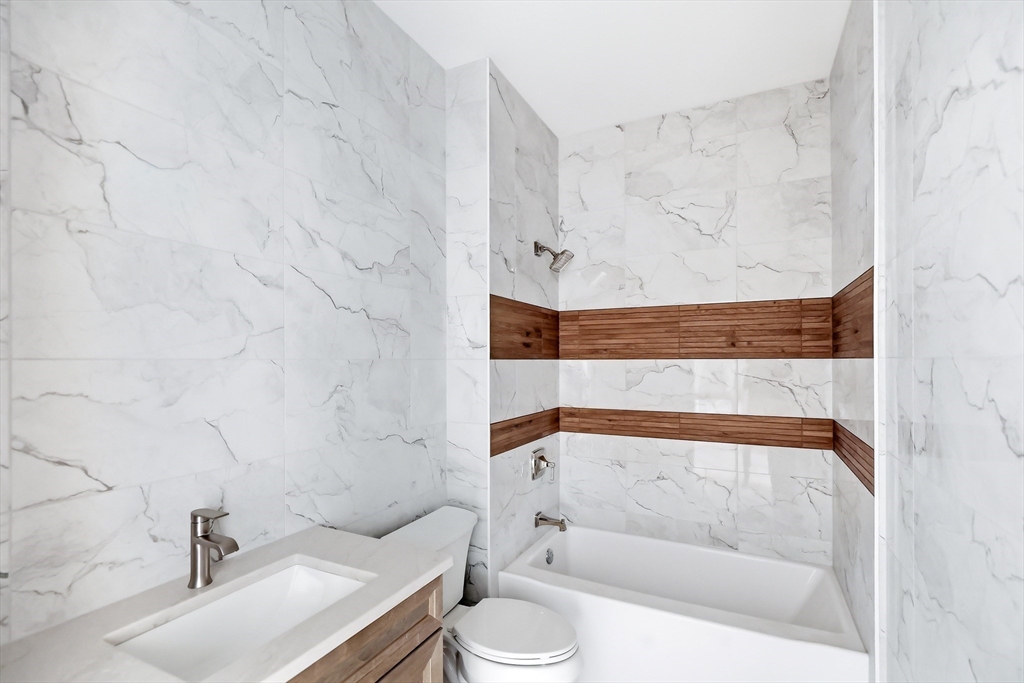 13 Elizabeth Lane, Unit 13 Easthampton, MA 01027 - Photo 16 of 26 a bathroom with a sink and toilet
