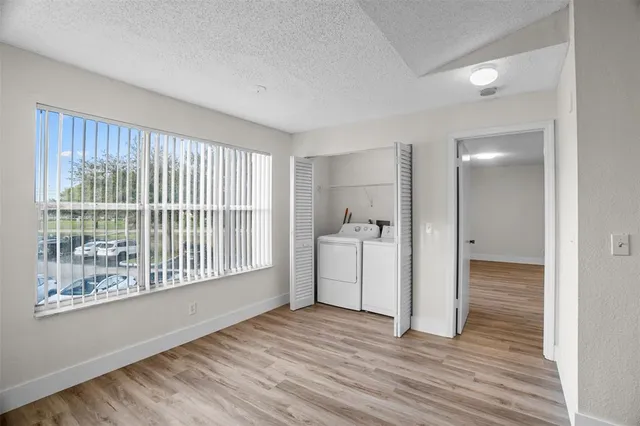 a view of a kitchen with a sink and a window