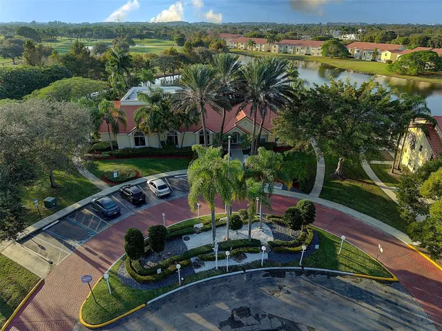 an aerial view of a house with garden space and outdoor seating