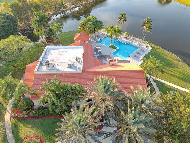 a view of a swimming pool with a yard