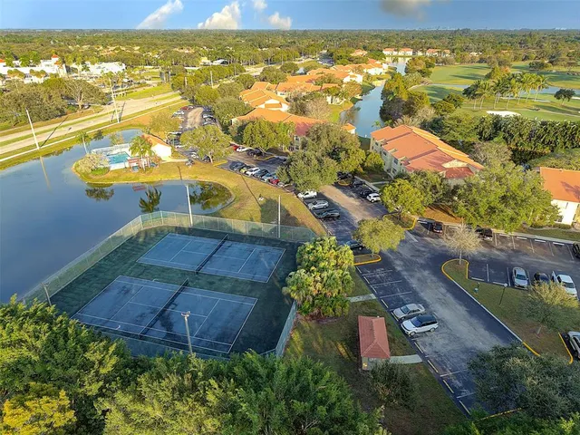 an aerial view of residential houses with outdoor space