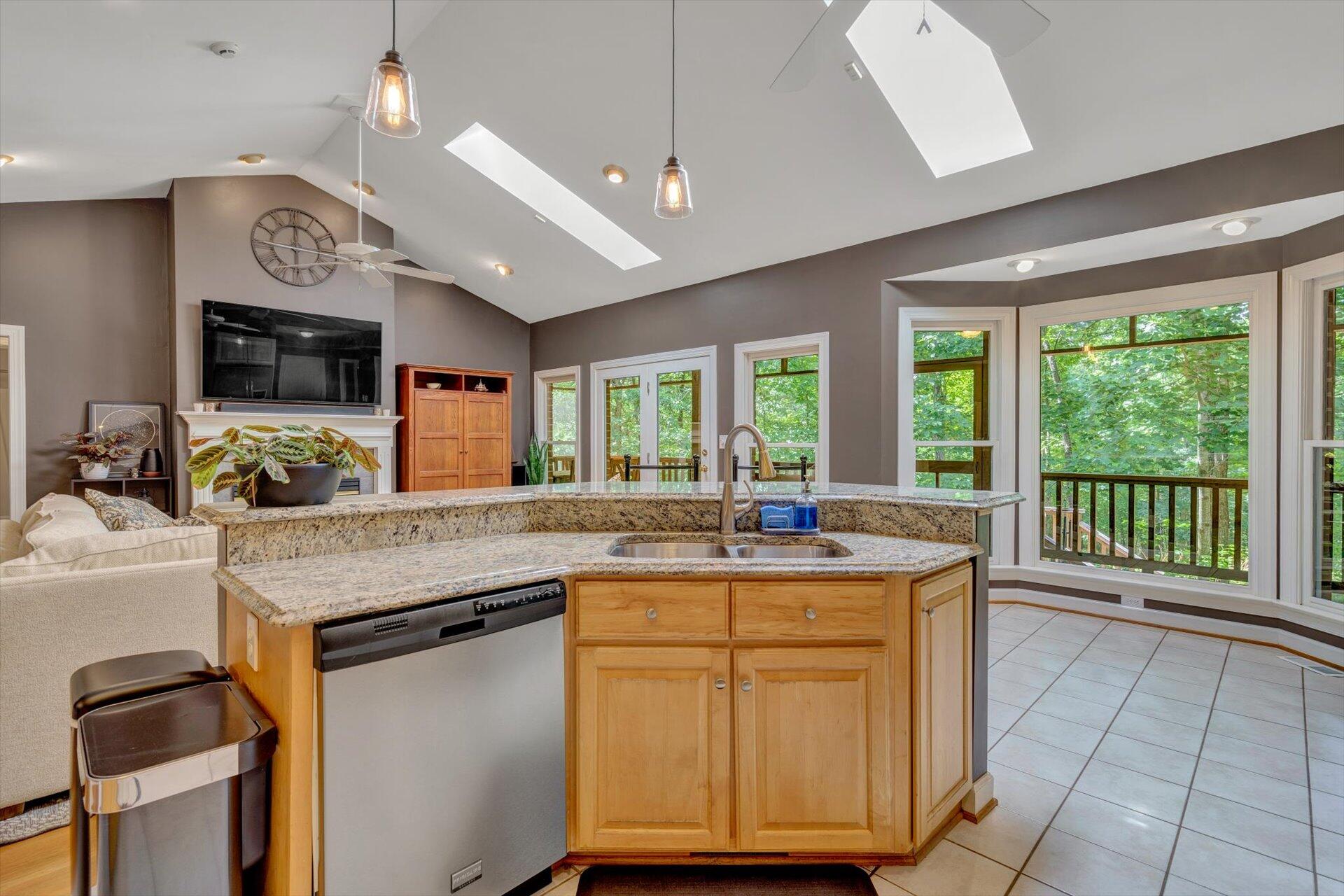 2795 New Ridge Road Elliston, VA 24087 - Photo 18 of 46 a kitchen with kitchen island granite countertop a sink and a stove