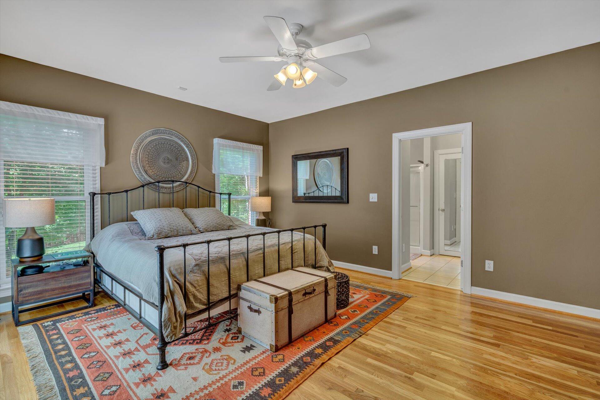 2795 New Ridge Road Elliston, VA 24087 - Photo 19 of 46 a bedroom with a bed and a chandelier
