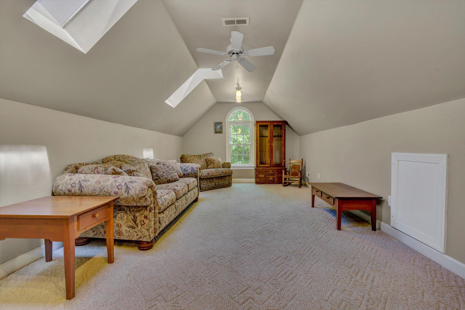 2795 New Ridge Road Elliston, VA 24087 - Photo 24 of 46 a living room with furniture and a chandelier