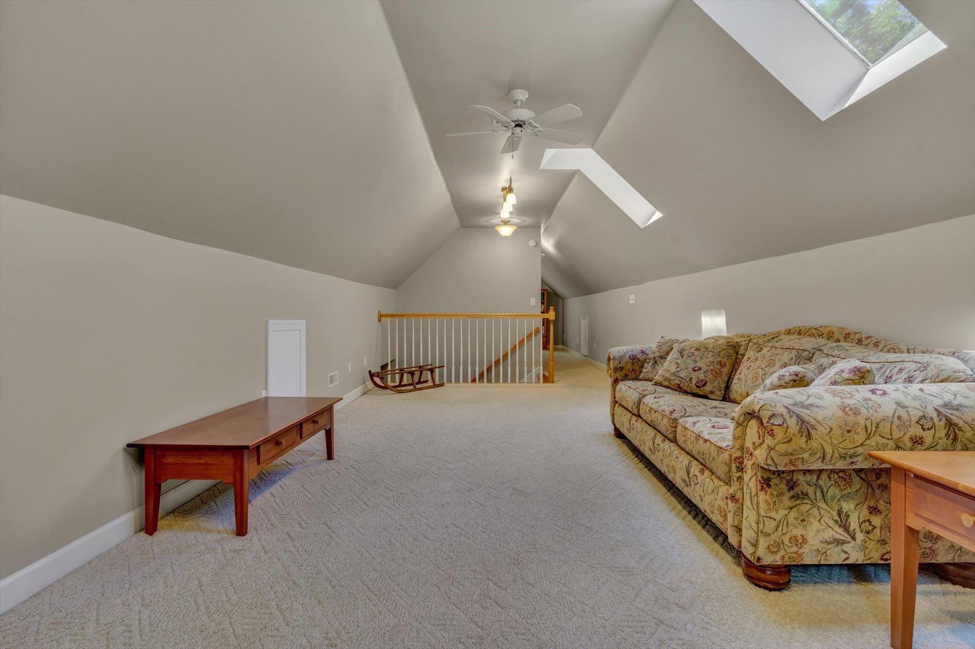 2795 New Ridge Road Elliston, VA 24087 - Photo 25 of 46 a living room with furniture and a chandelier