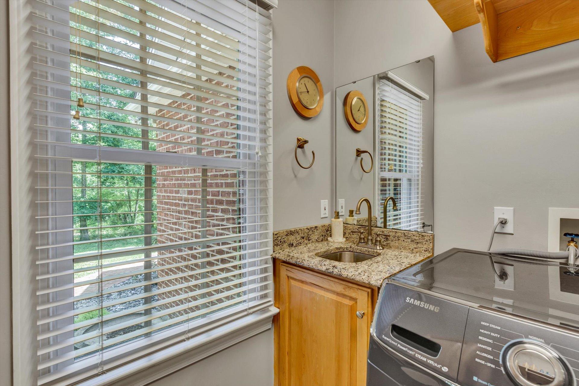 2795 New Ridge Road Elliston, VA 24087 - Photo 28 of 46 a bathroom with a granite countertop sink and a window