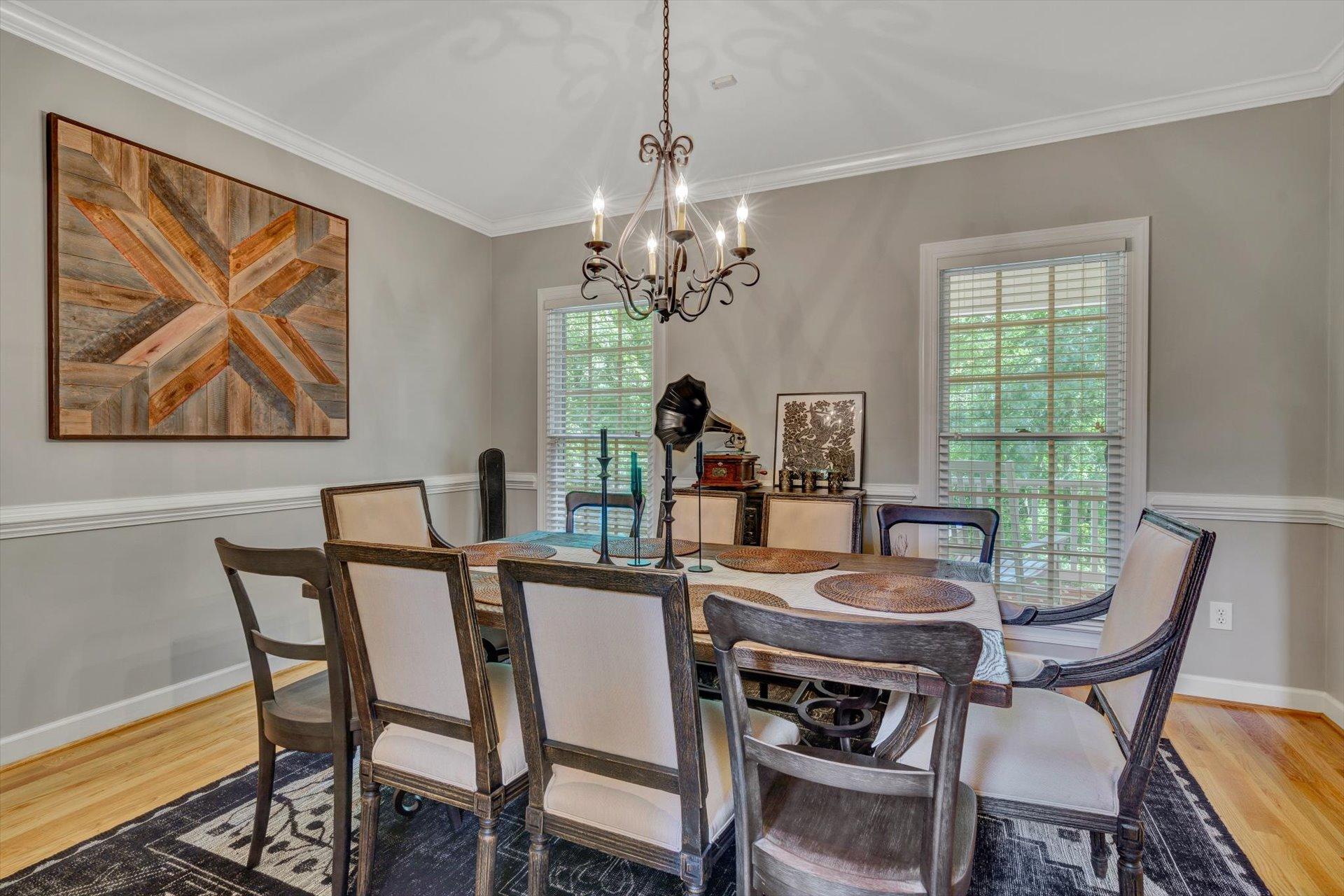 2795 New Ridge Road Elliston, VA 24087 - Photo 10 of 46 a dining room with furniture a rug and a chandelier
