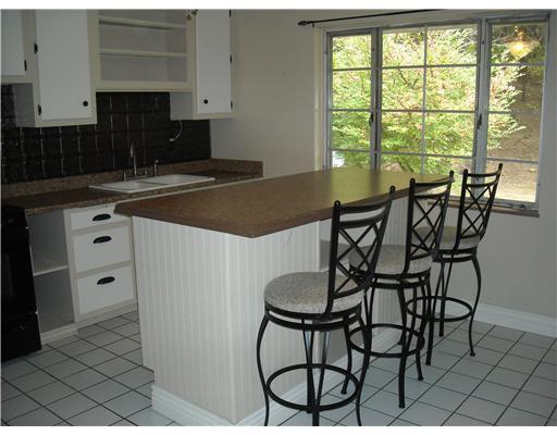 26 Monier Road Gibsonia, PA 15044 - Photo 3 of 15 Kitchen. Eat in kitchen features a fabulous island with 3 stools, ceramic tile and updated counter tops.