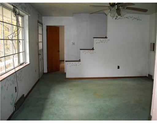 26 Monier Road Gibsonia, PA 15044 - Photo 5 of 15 Living Room. A view of the living room from family room. Hardwood under carpeting.