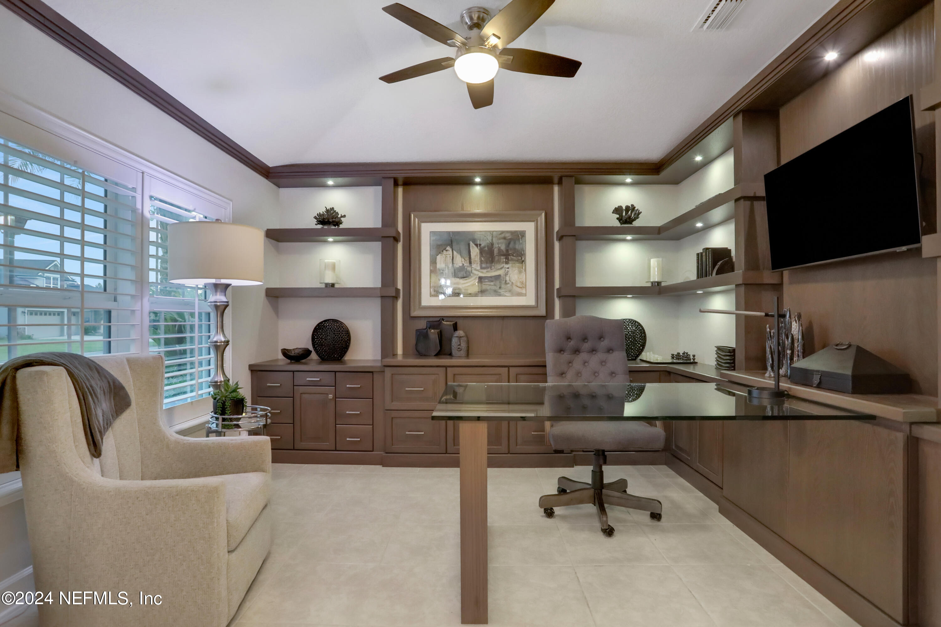 183 Flora Lake Circle St. Augustine, FL 32095 - Photo 14 of 40 a living room with furniture and a flat screen tv