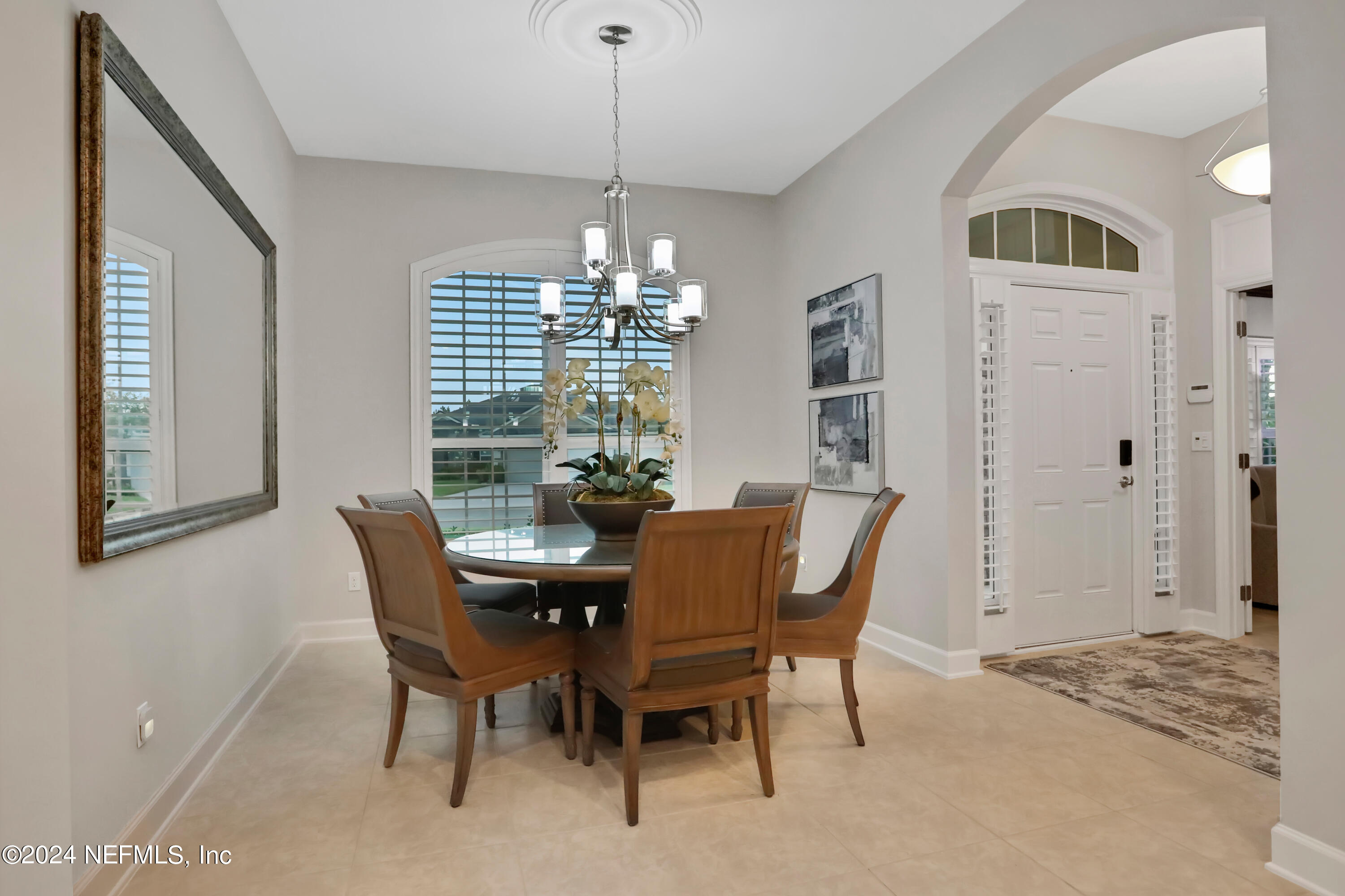 183 Flora Lake Circle St. Augustine, FL 32095 - Photo 18 of 40 a view of a dining room with furniture and chandelier