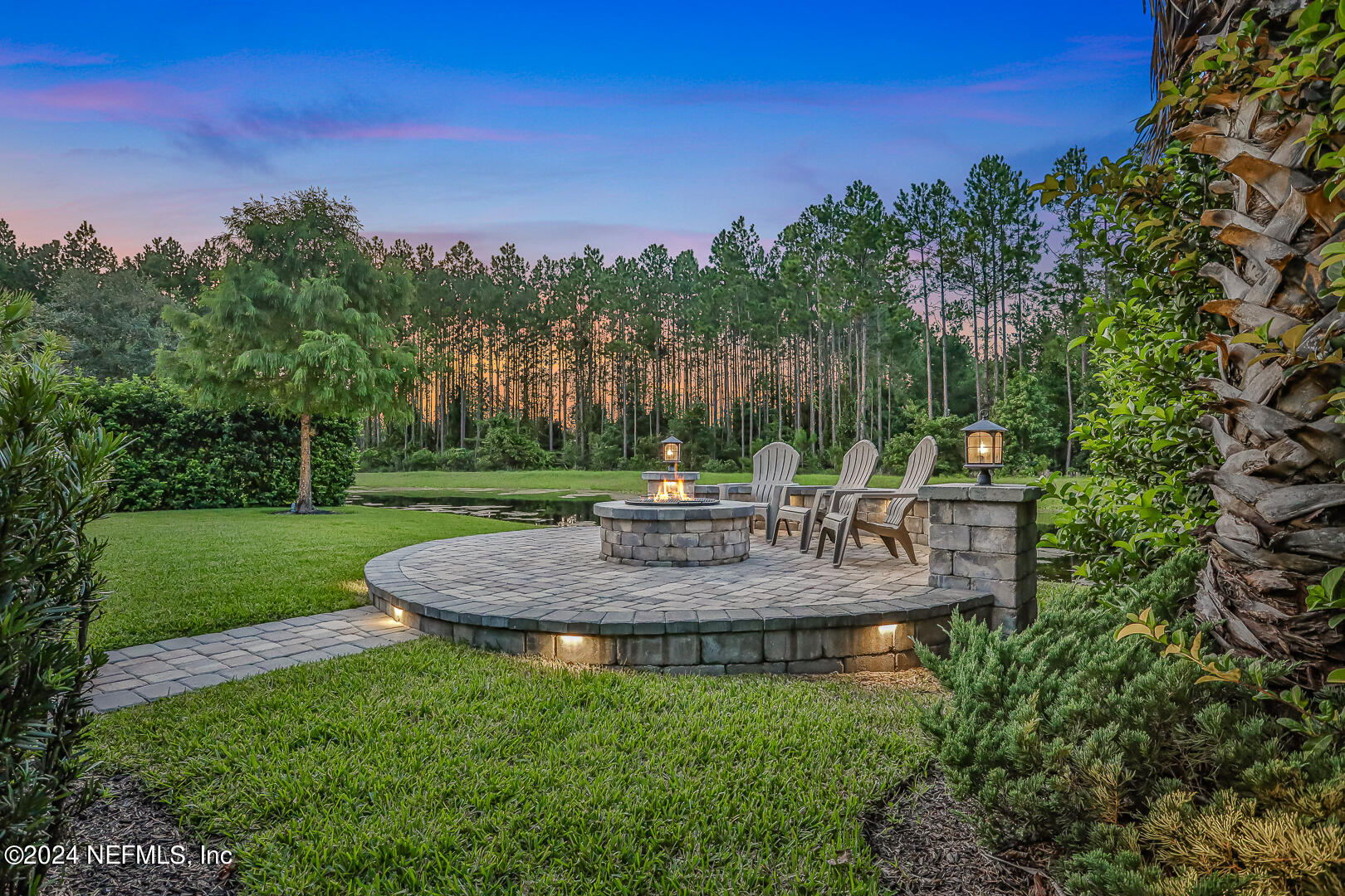 183 Flora Lake Circle St. Augustine, FL 32095 - Photo 2 of 40 a view of a garden with trees