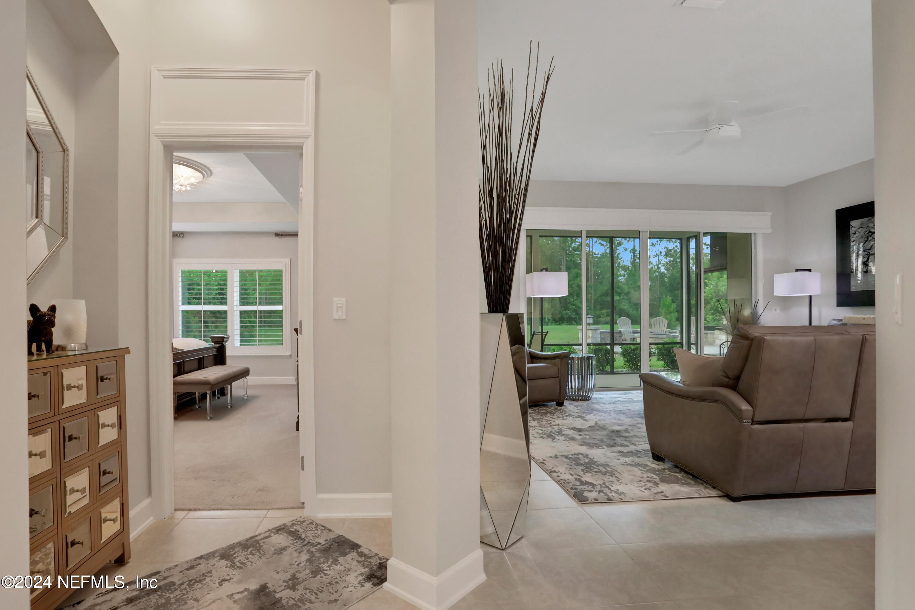 183 Flora Lake Circle St. Augustine, FL 32095 - Photo 27 of 40 a living room with furniture and a large window