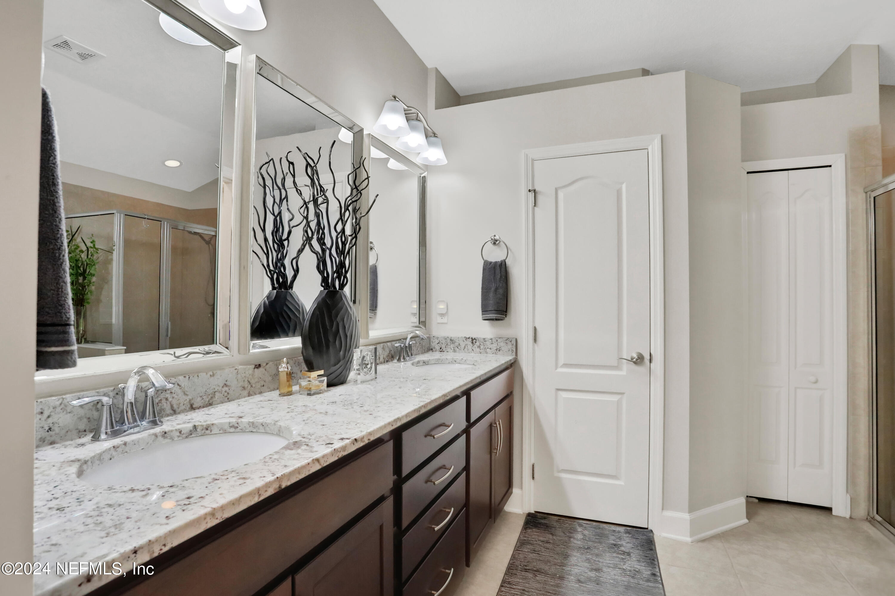 183 Flora Lake Circle St. Augustine, FL 32095 - Photo 31 of 40 a bathroom with a granite countertop sink and a mirror