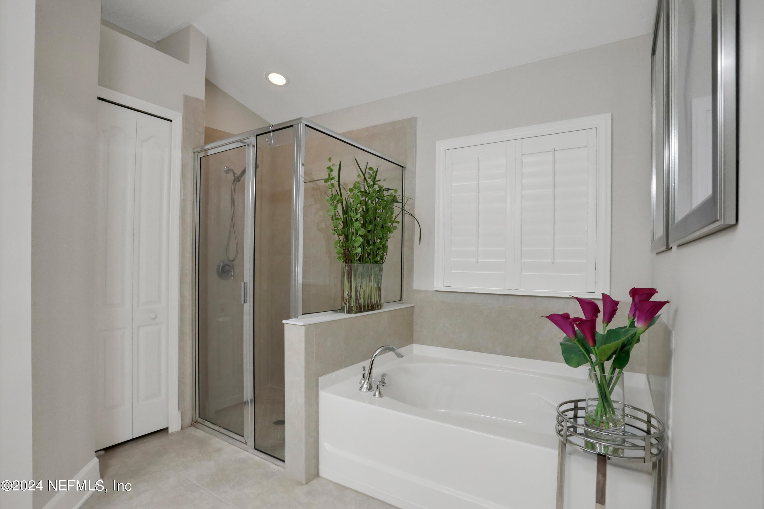 183 Flora Lake Circle St. Augustine, FL 32095 - Photo 32 of 40 a white bath tub sitting next to a white door
