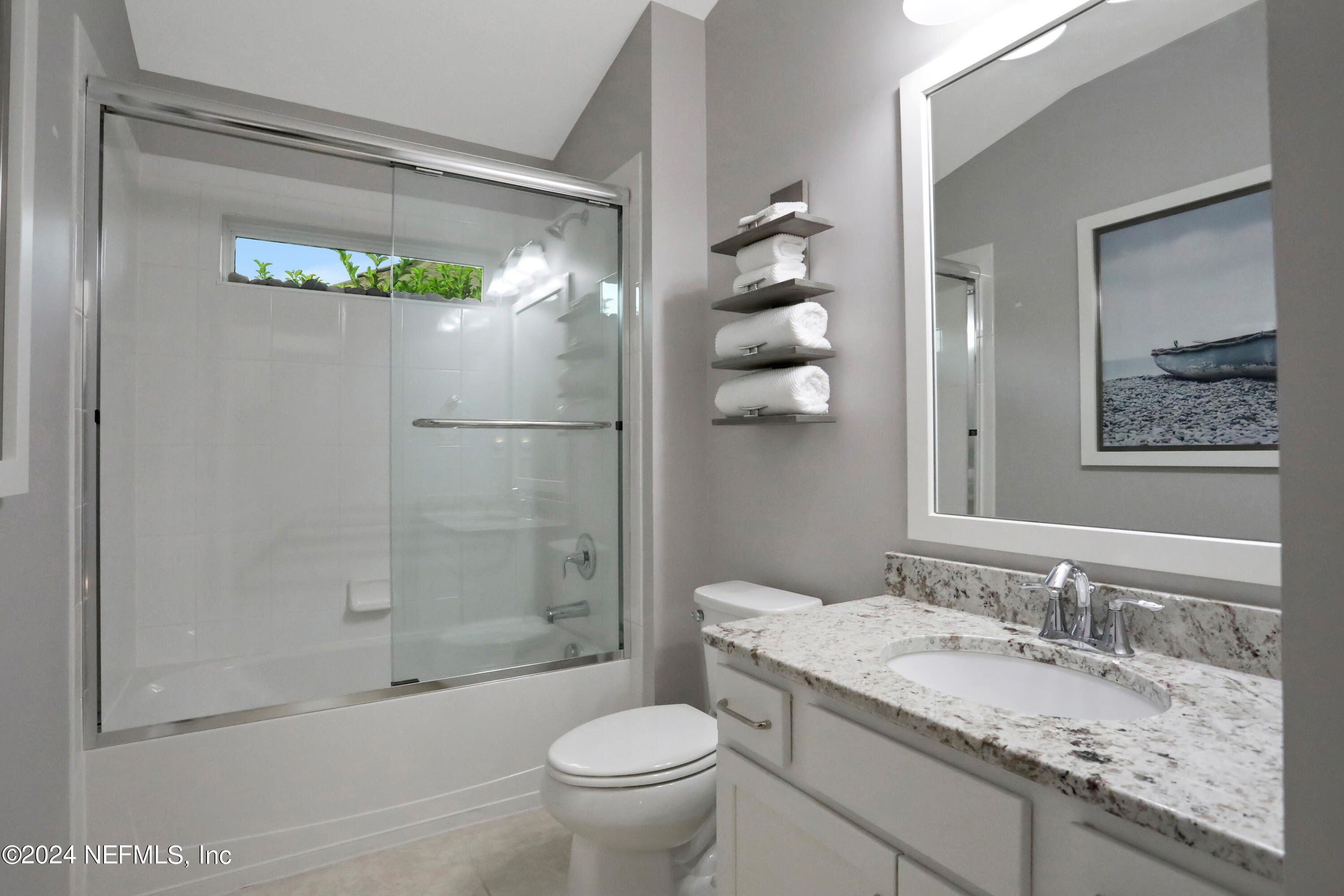 183 Flora Lake Circle St. Augustine, FL 32095 - Photo 36 of 40 a bathroom with a granite countertop sink toilet and shower