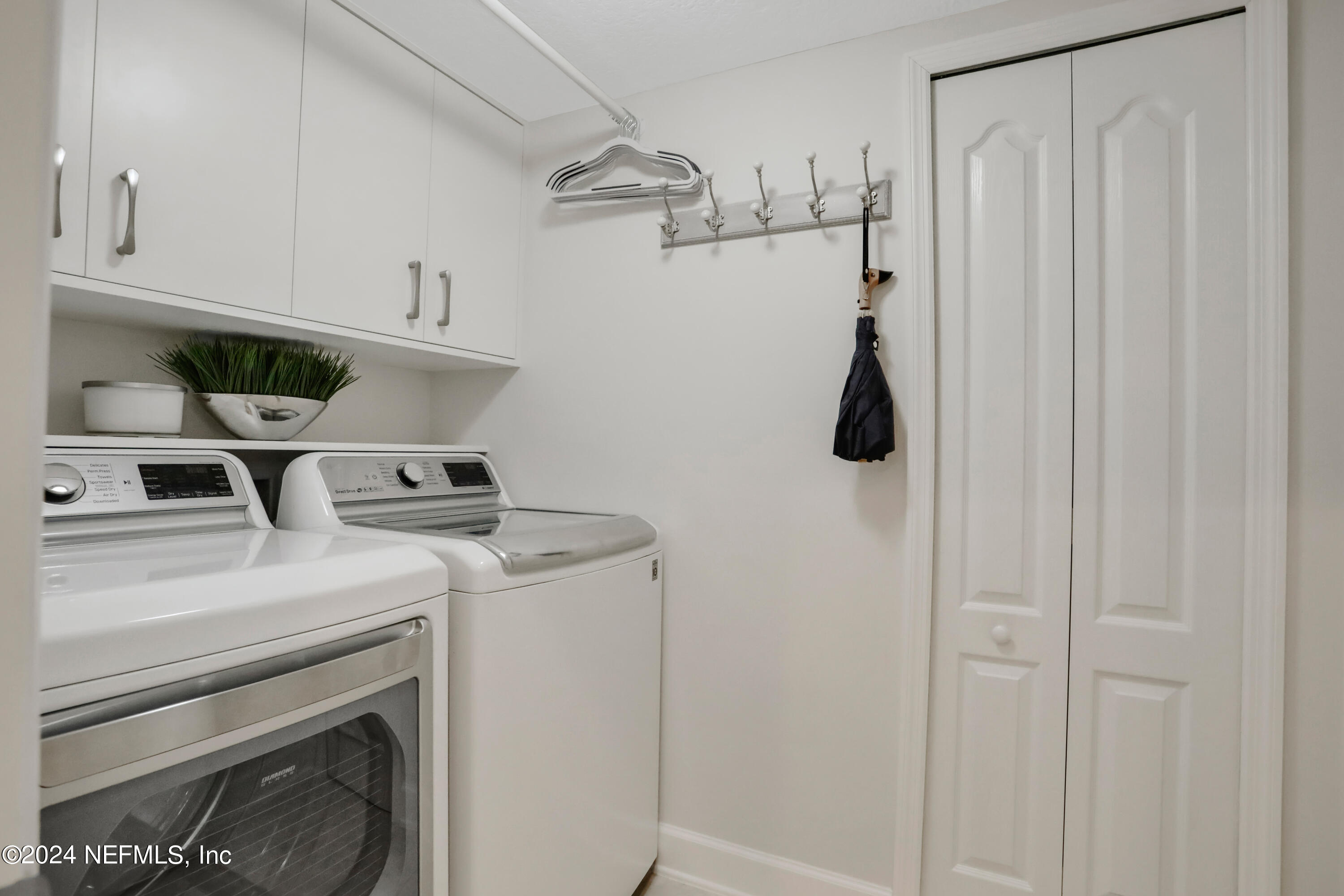 183 Flora Lake Circle St. Augustine, FL 32095 - Photo 40 of 40 a utility room with dryer and washer