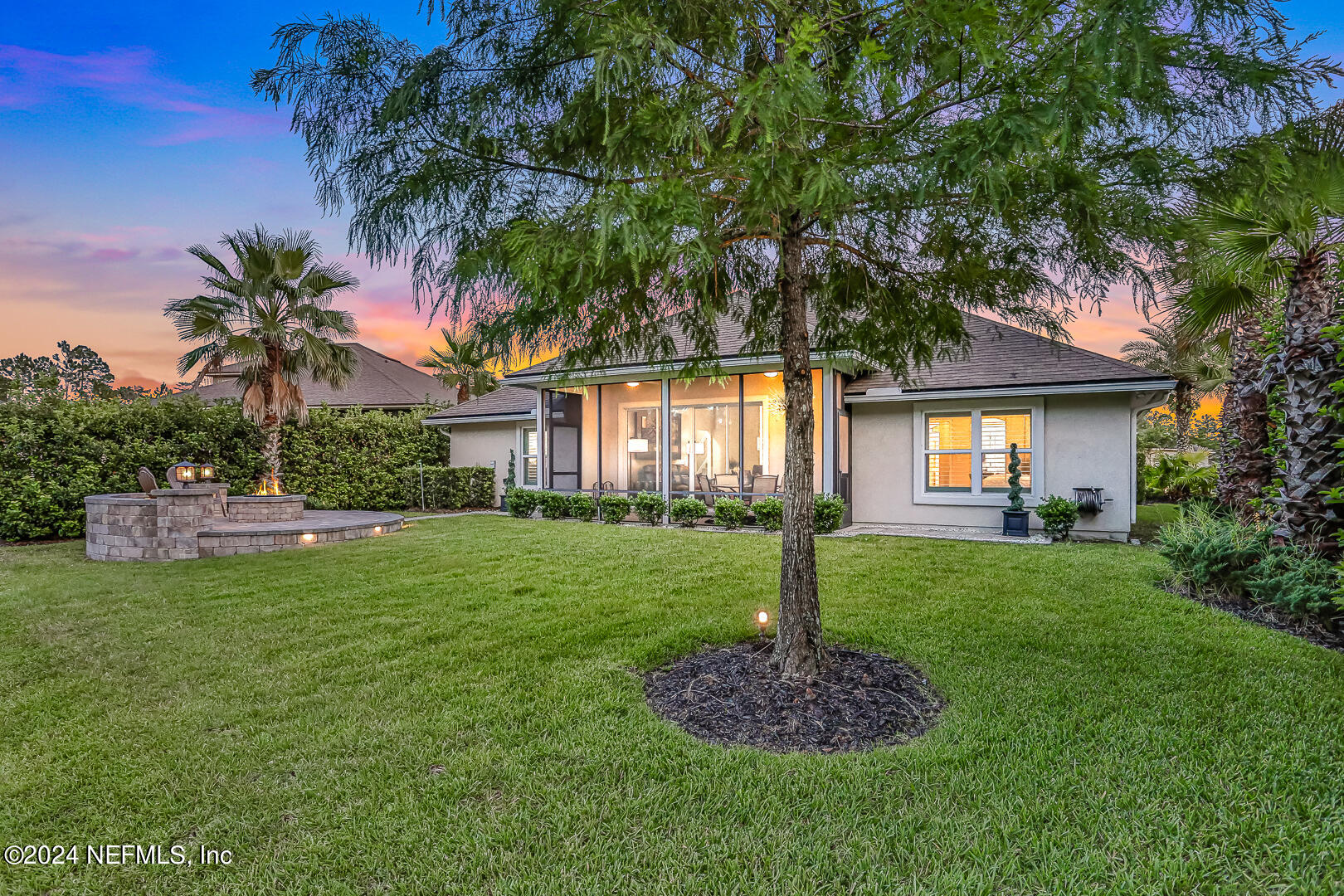 183 Flora Lake Circle St. Augustine, FL 32095 - Photo 5 of 40 a front view of a house with a garden