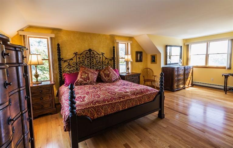 13 Snows Road Truro, MA 02666 - Photo 14 of 28 a bedroom with a bed and wooden floor
