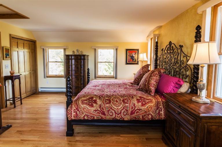 13 Snows Road Truro, MA 02666 - Photo 15 of 28 a bed sitting in a bedroom next to a window