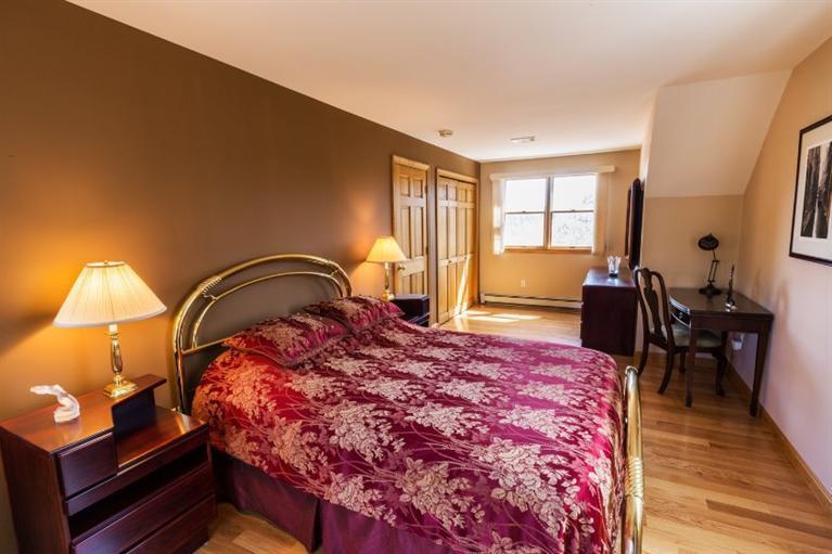 13 Snows Road Truro, MA 02666 - Photo 18 of 28 a bedroom with a bed and wooden floor