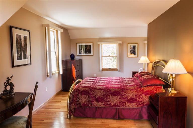 13 Snows Road Truro, MA 02666 - Photo 19 of 28 a bedroom with a bed and wooden floor