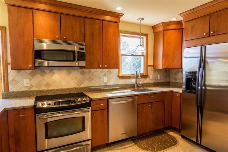 13 Snows Road Truro, MA 02666 - Photo 6 of 28 a kitchen with a sink stove and microwave