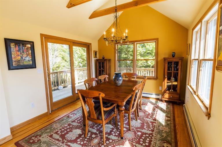 13 Snows Road Truro, MA 02666 - Photo 9 of 28 a view of a dining room with furniture window and wooden floor