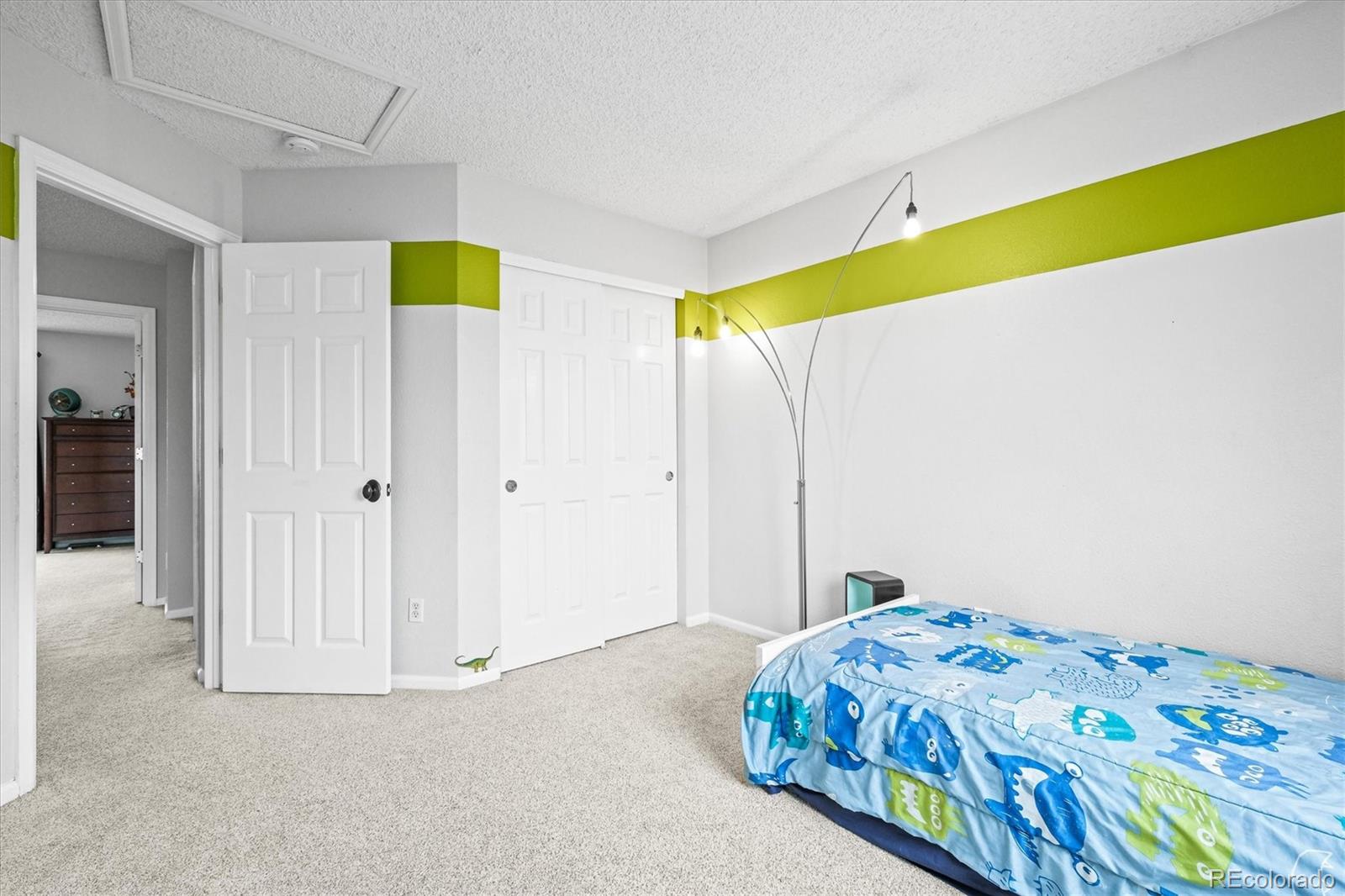 951 Timbervale Trail Highlands Ranch, CO 80129 - Photo 17 of 33 a bedroom with a bed and a window