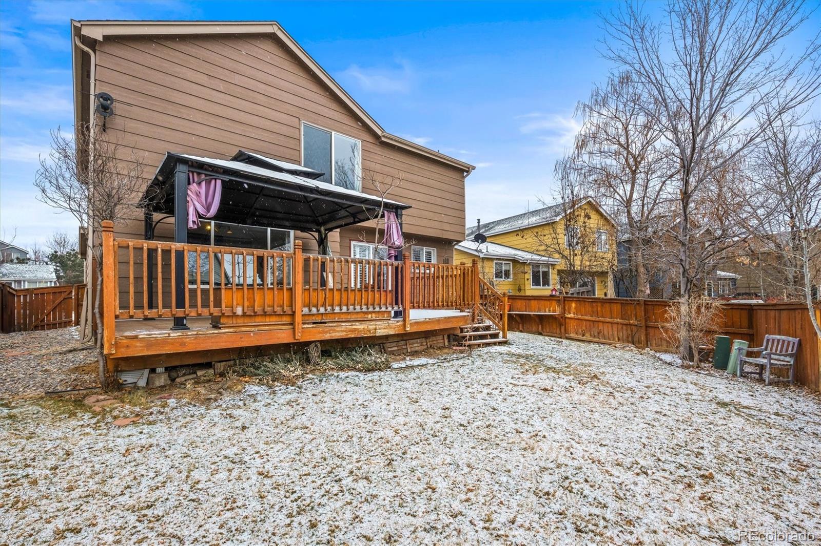 951 Timbervale Trail Highlands Ranch, CO 80129 - Photo 26 of 33 a view of a house with a yard