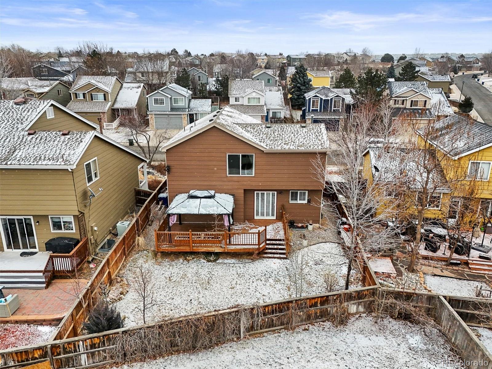 951 Timbervale Trail Highlands Ranch, CO 80129 - Photo 27 of 33 an aerial view of a house with a yard
