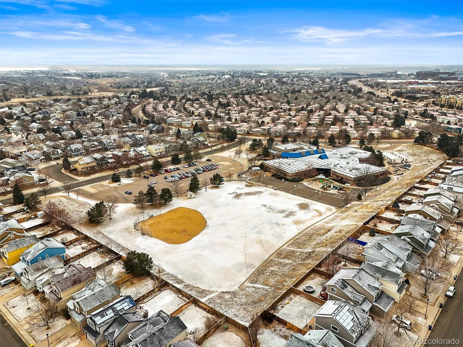 951 Timbervale Trail Highlands Ranch, CO 80129 - Photo 30 of 33 an aerial view of a swimming pool with outdoor space