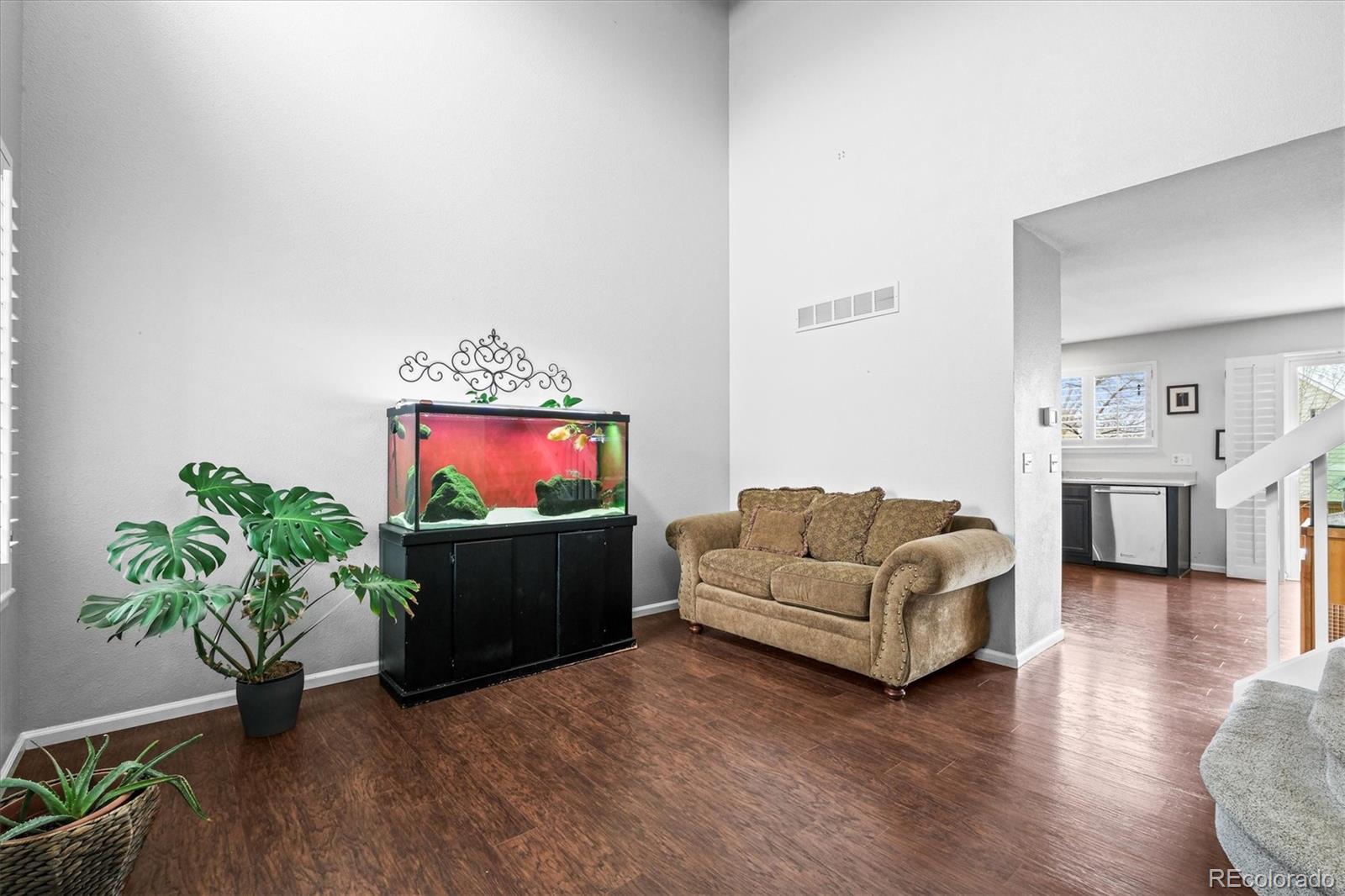 951 Timbervale Trail Highlands Ranch, CO 80129 - Photo 3 of 33 a living room with furniture and a flat screen tv
