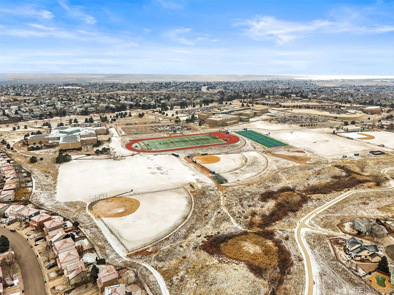 951 Timbervale Trail Highlands Ranch, CO 80129 - Photo 31 of 33 an aerial view of residential houses with outdoor space