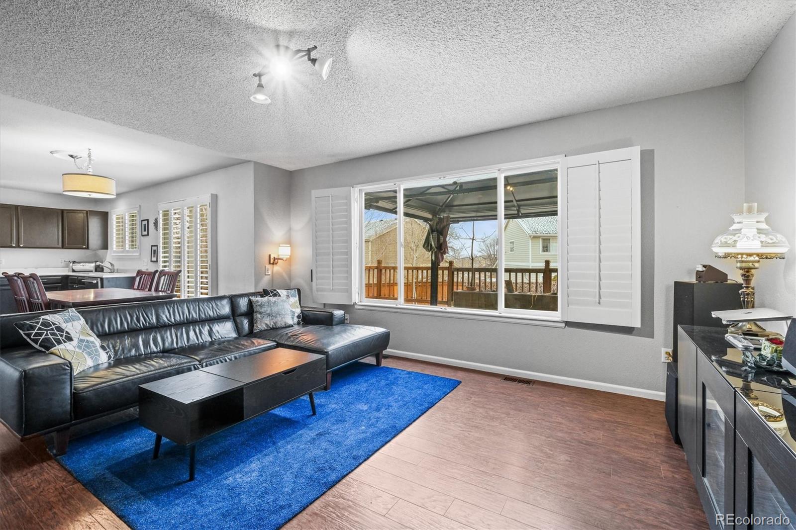 951 Timbervale Trail Highlands Ranch, CO 80129 - Photo 9 of 33 a living room with furniture and a large window
