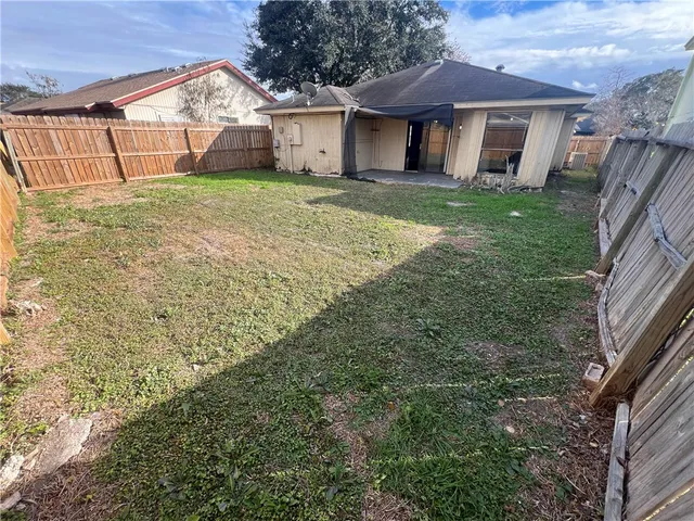 a view of a yard in front view of a house