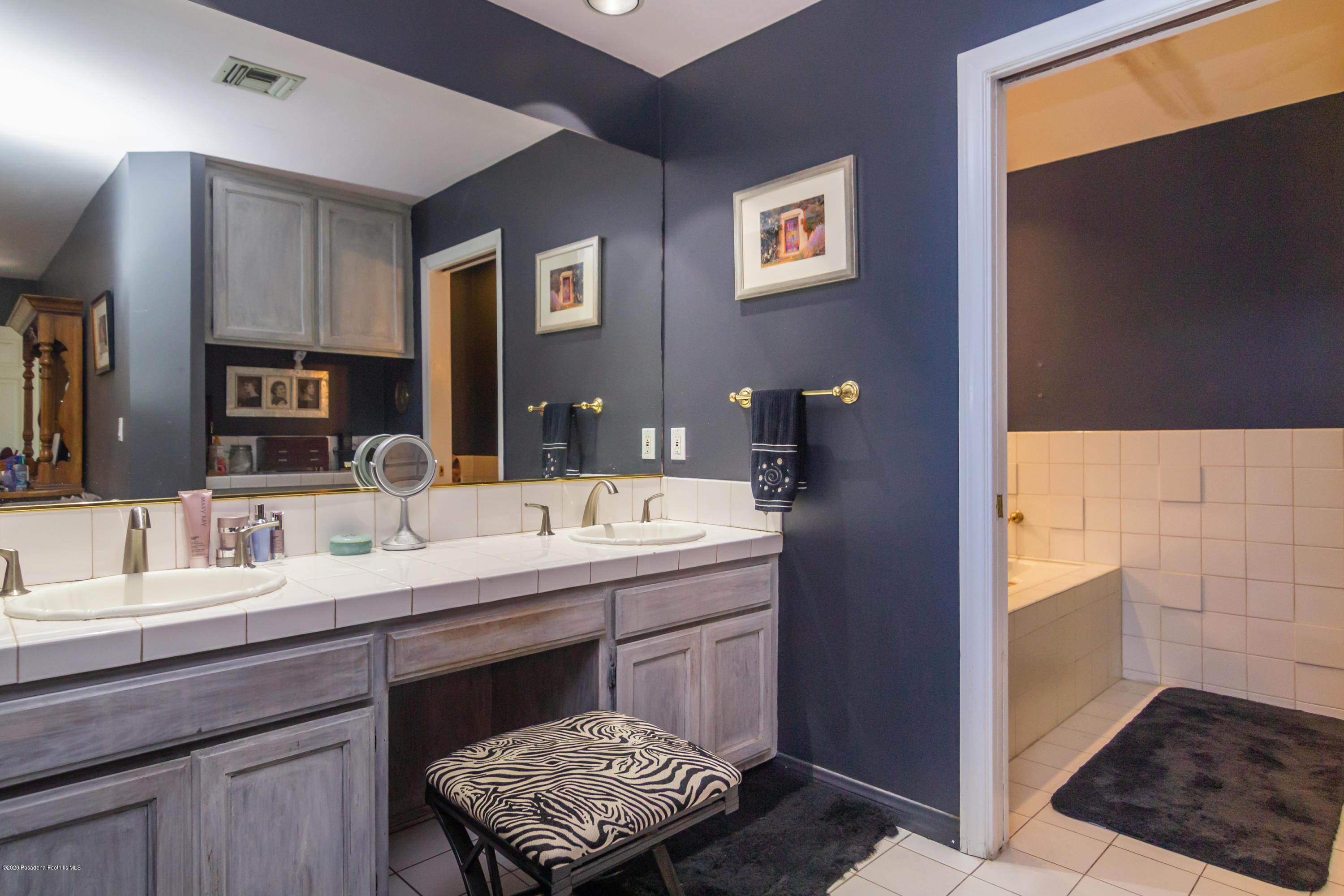266 Melcanyon Road Duarte, CA 91010 - Photo 17 of 27 a en suite bathroom with a sink and a mirror