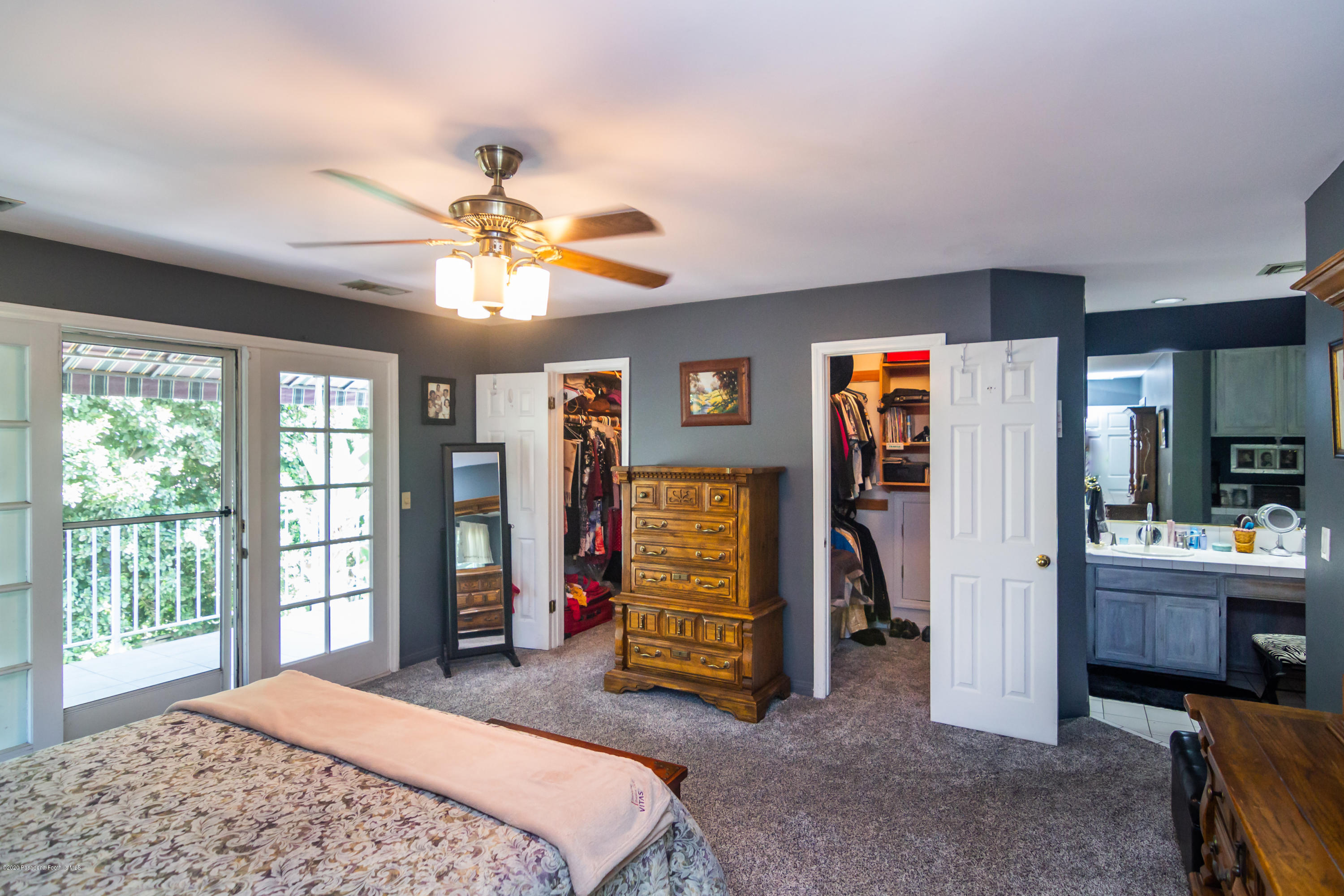 266 Melcanyon Road Duarte, CA 91010 - Photo 19 of 27 a bedroom with a bed and a chandelier