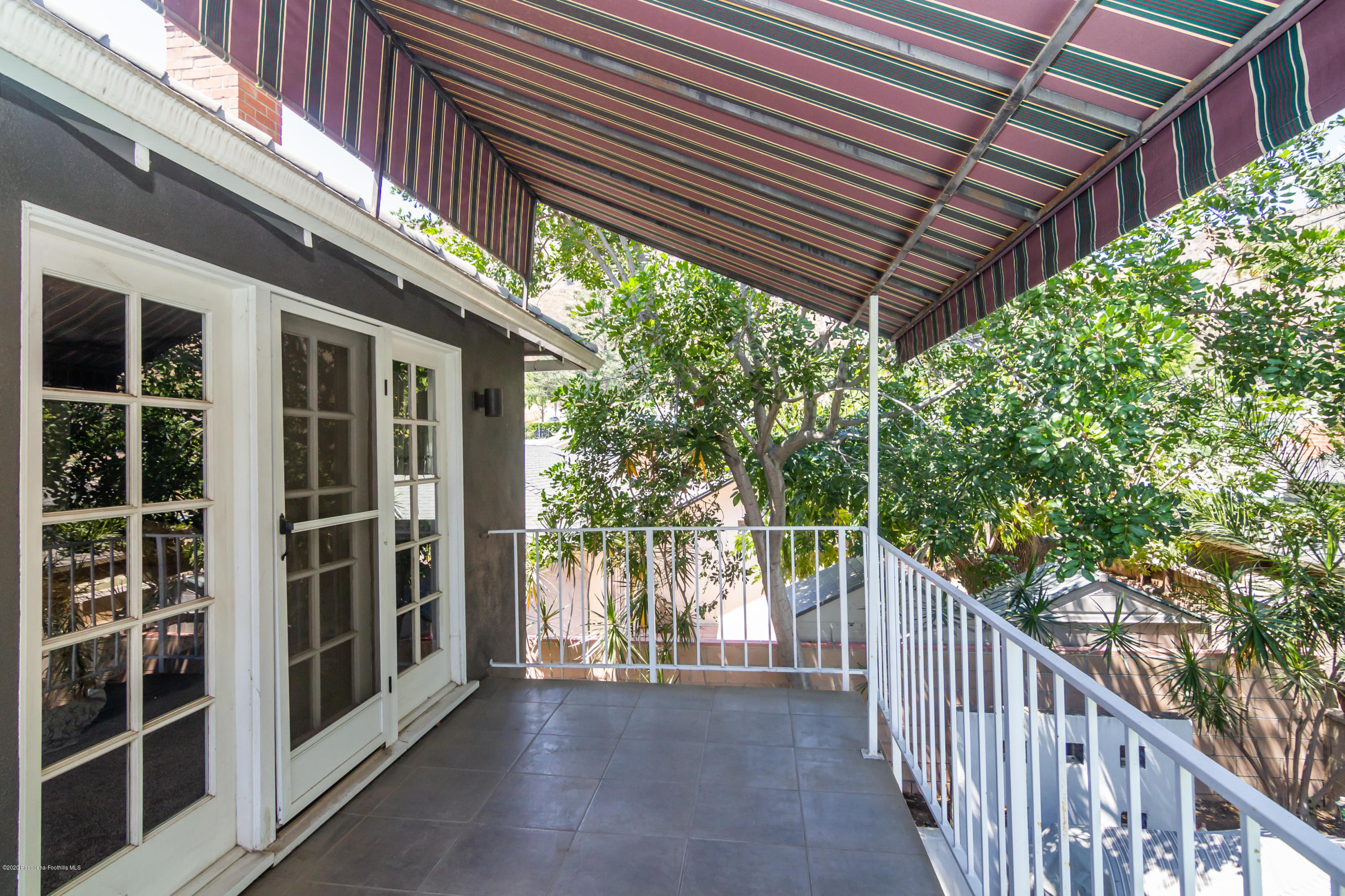 266 Melcanyon Road Duarte, CA 91010 - Photo 20 of 27 a view of a porch with wooden floor and roof with a garden view