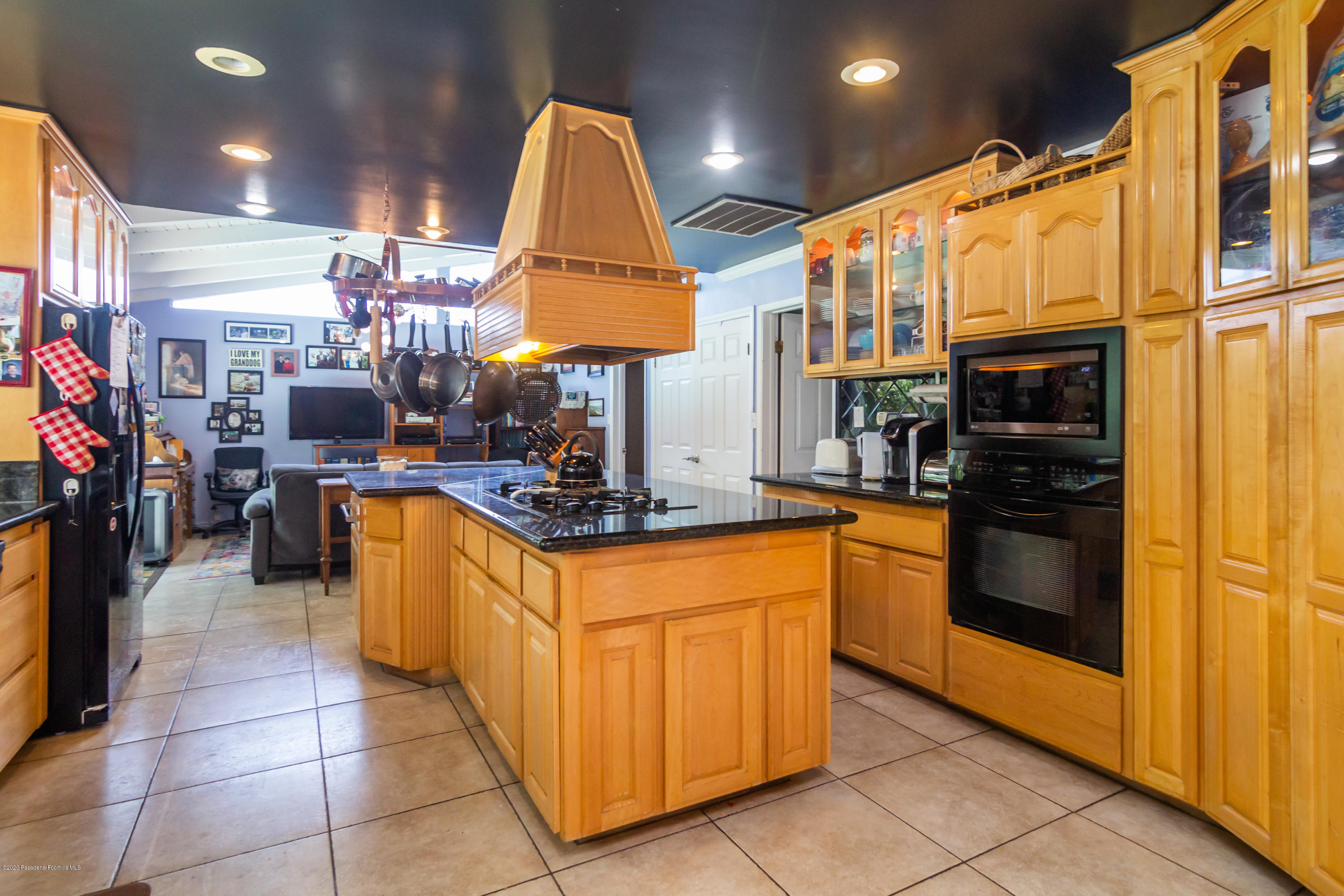 266 Melcanyon Road Duarte, CA 91010 - Photo 7 of 27 a kitchen with stainless steel appliances granite countertop a sink and cabinets