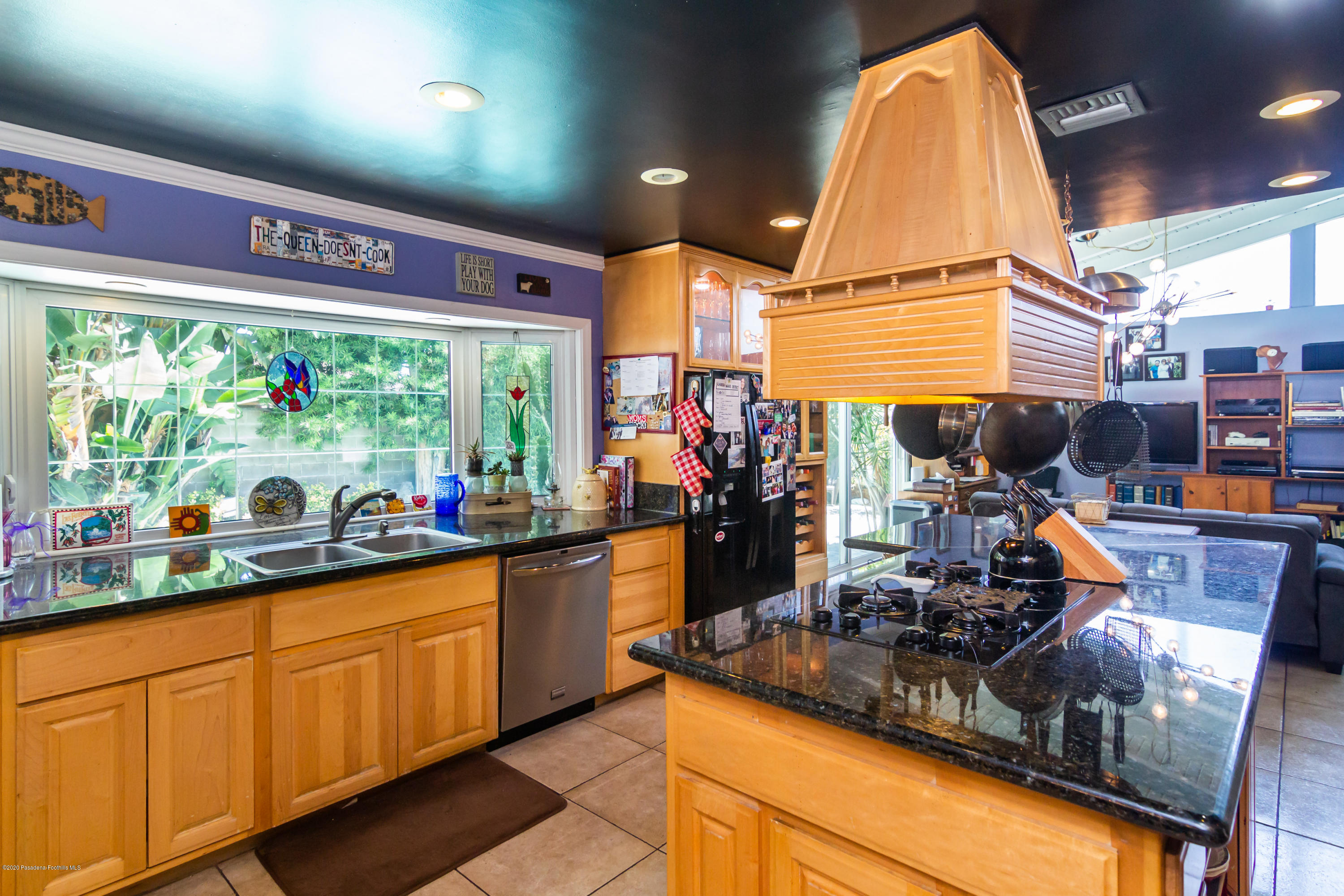266 Melcanyon Road Duarte, CA 91010 - Photo 8 of 27 a kitchen with lots of counter top space and wooden floor