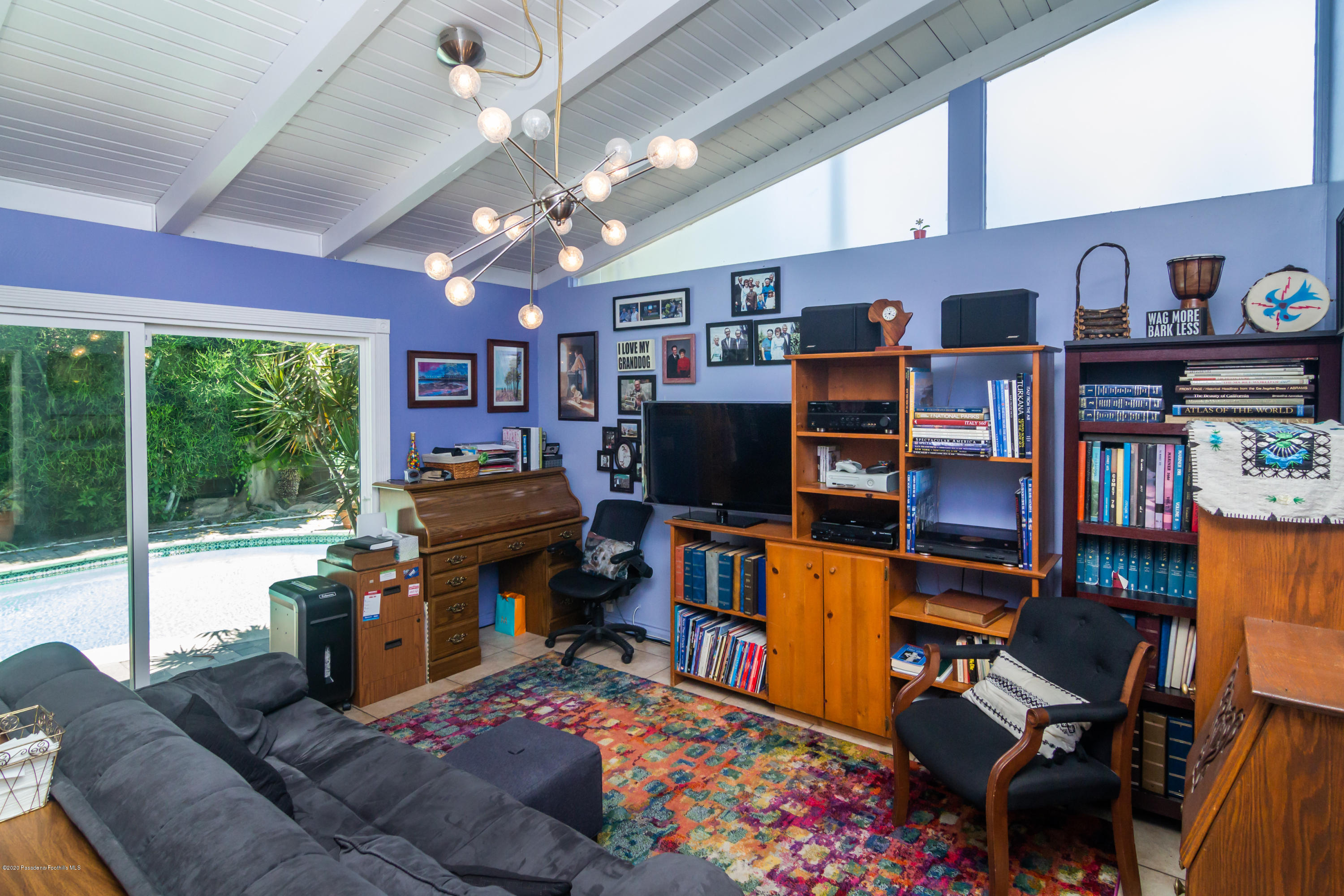 266 Melcanyon Road Duarte, CA 91010 - Photo 9 of 27 a living room with furniture a flat screen tv and a floor to ceiling window