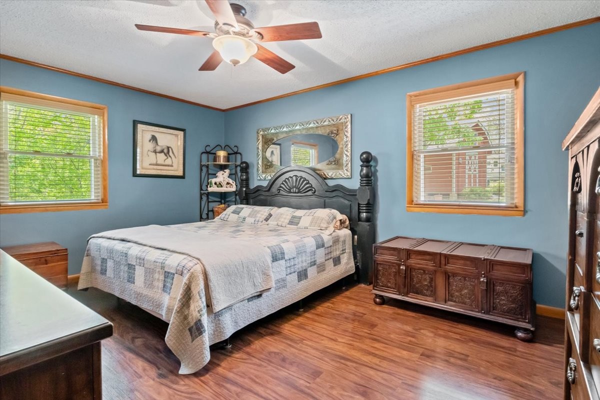 48 Hill Road Big Sandy, TN 38221 - Photo 14 of 54 a bedroom with a bed and a window