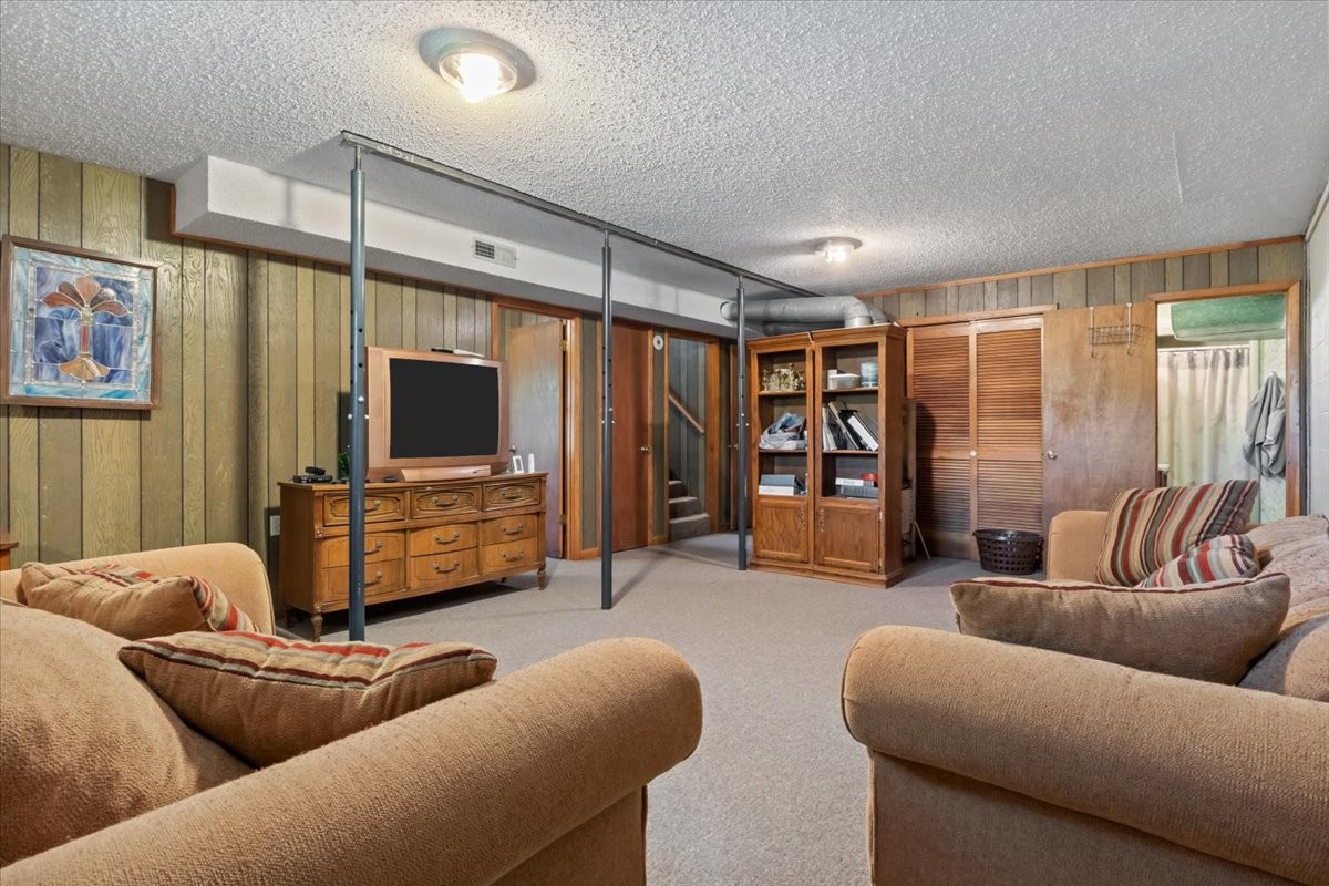 48 Hill Road Big Sandy, TN 38221 - Photo 21 of 54 a living room with furniture and a flat screen tv